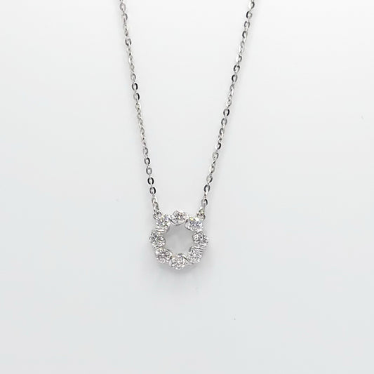 Silver-tone chain necklace with circular halo pendant and small round stones