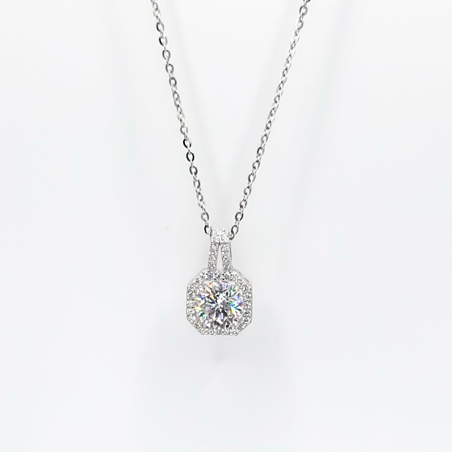 Silver moissanite pendant necklace with round halo solitaire setting on chain