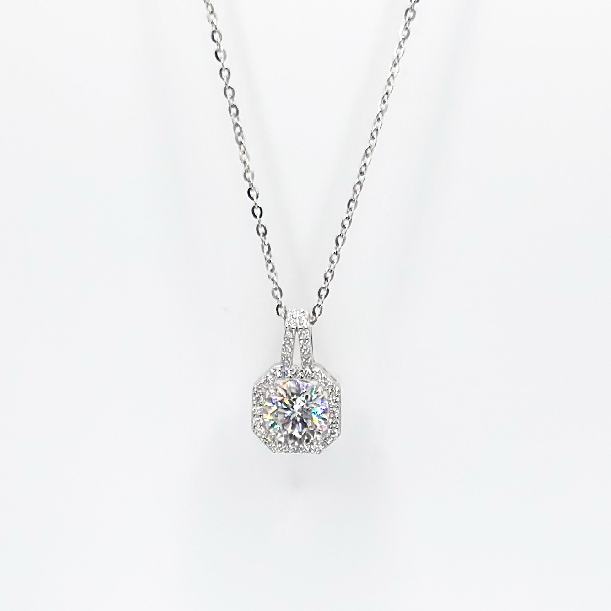 Silver moissanite pendant necklace with round halo solitaire setting on chain