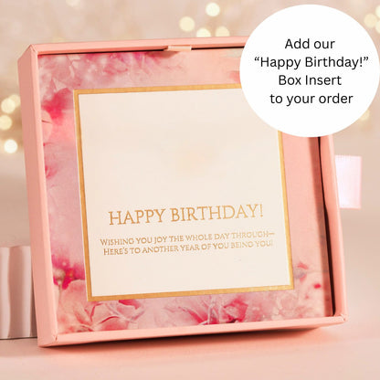 Happy Birthday box insert card with gold text on a pink gift insert
