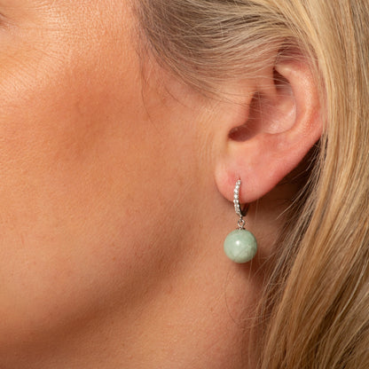 Silver-tone huggie hoop earring with pave bezel and round green jade drop