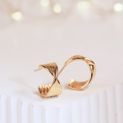 Twisted half hoop earrings, gold-tone hoops with twisted clasp detail