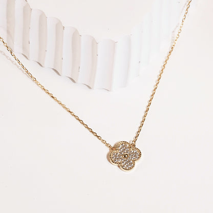 four-leaf clover necklace with gold chain and glittering clover charm pendant