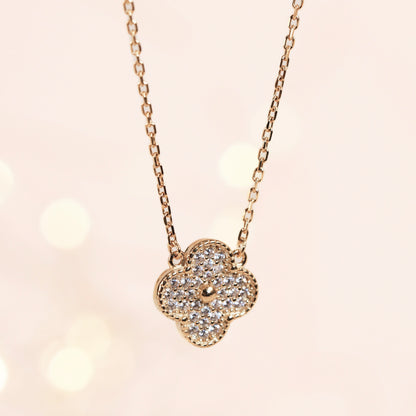 four-leaf clover necklace with gold chain and rhinestone clover pendant