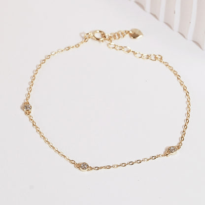 Gold CZ diamond trio bracelet with three round stone links, cable chain