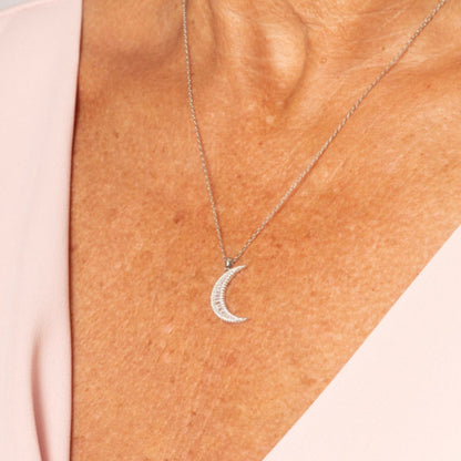 Crescent moon pendant necklace with pavé stones, silver tone on chain