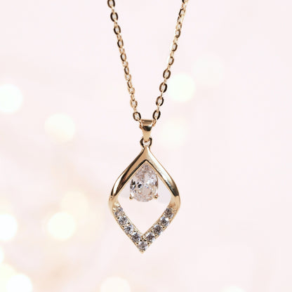 Two-tone teardrop pendant necklace with clear center stone and pavé border