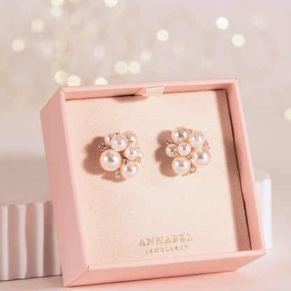 Pearl cluster stud earrings with round white pearls and rhinestone-like sparkle accents