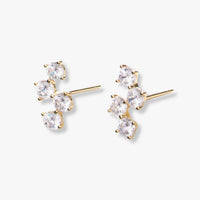 Pair of four-stone diamond stud earrings, gold-tone posts and prong settings