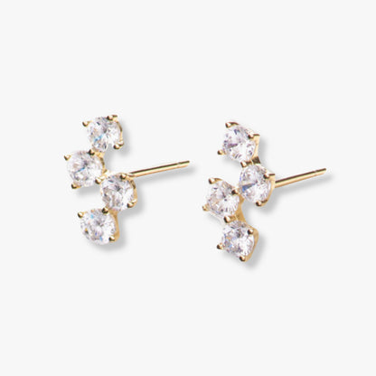 Gold diamond stud earrings with four clear stones and prong settings