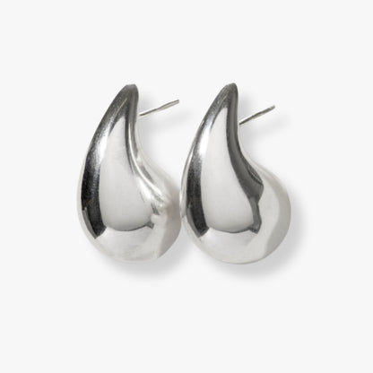 Pair of polished silver teardrop earrings with reflective smooth teardrop outline