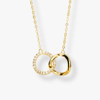 Gold interlocking circles pendant necklace with crystal accents on chain