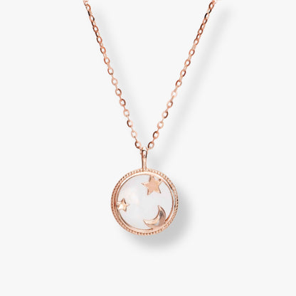 Rose gold moon and star pendant necklace with round bezel and chain