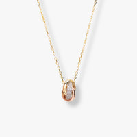 Mixed-metal knot necklace with oval pendant and pavé sparkle, gold chain