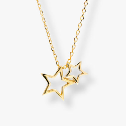 Gold star necklace with two star pendants on a chunky link chain