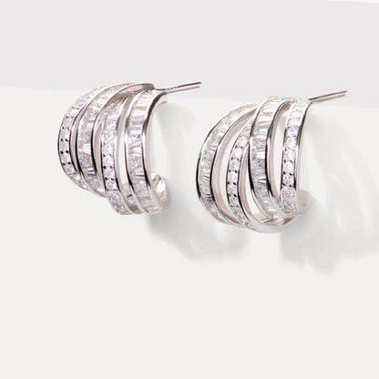 Chunky sterling silver half hoop earrings with crystal-lined curved bands
