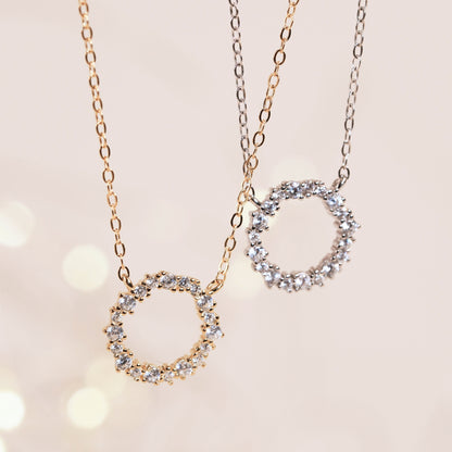 Layered circle pendant necklaces with round halo pendants and fine chain links