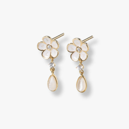 Gold-tone enamel flower drop earrings with white petals and teardrop pearl-like drops
