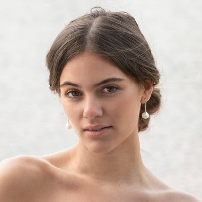 Long pearl drop earrings with pearl dangle and pavé rhinestone details