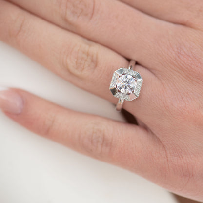 Lab-grown diamond cocktail ring on finger, square halo with round center stone
