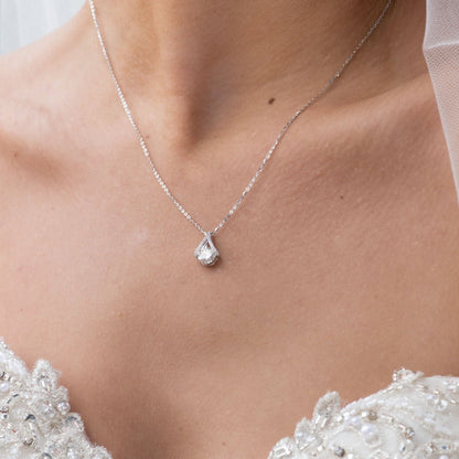 Teardrop diamond stud earring with pear-shaped, faceted stone