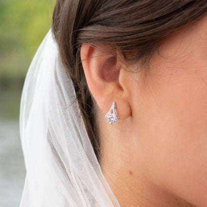 Teardrop diamond stud earring with pear-shaped stone and small prongs