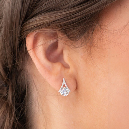Teardrop diamond stud earrings with prong-set pear-shaped stone