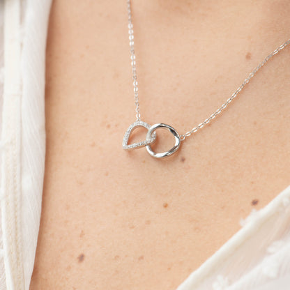 Silver-tone interlocking circles necklace with crystal accents, linked pendant