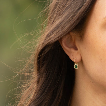 Gold-tone CZ stud drop earrings with small pavé hoop and square green stone