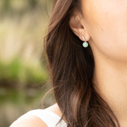 Turquoise jade round drop earrings with silver-tone clear-stone bezel tops