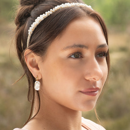 Freshwater pearl statement earrings with gold-tone caps and large white baroque pearls