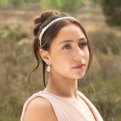 Pearl crystal headband worn on model, white pearl beads with gold-tone trim