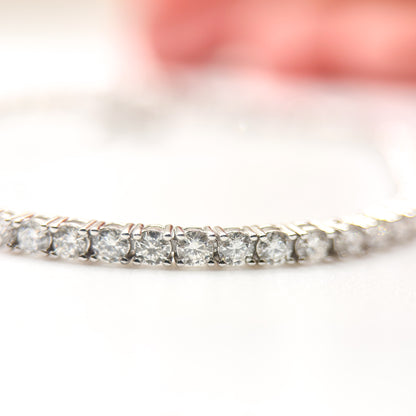 Moissanite tennis bracelet with round clear stones in a shimmering row