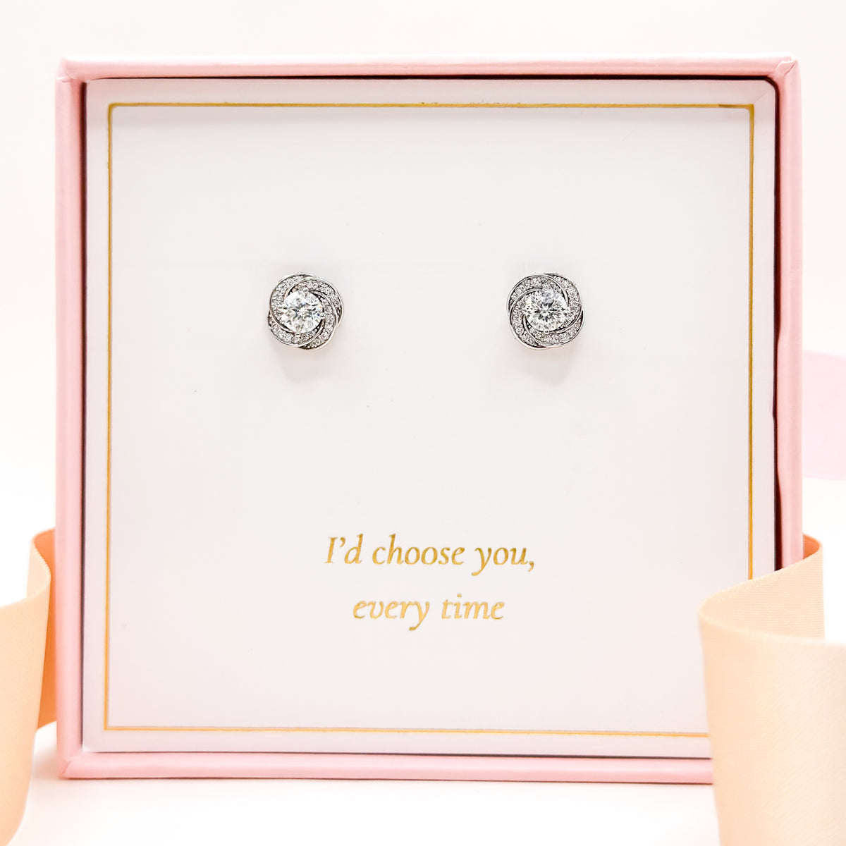 Moissanite silver stud earrings with round faceted stones, pair of sparkling studs