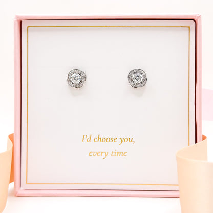 Moissanite silver stud earrings with round faceted stones, pair of sparkling studs