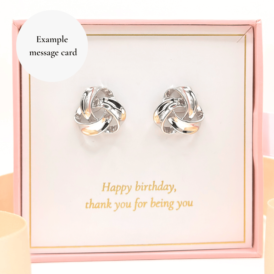 Pair of polished sterling silver knot earrings, chunky circular twist, in gift box