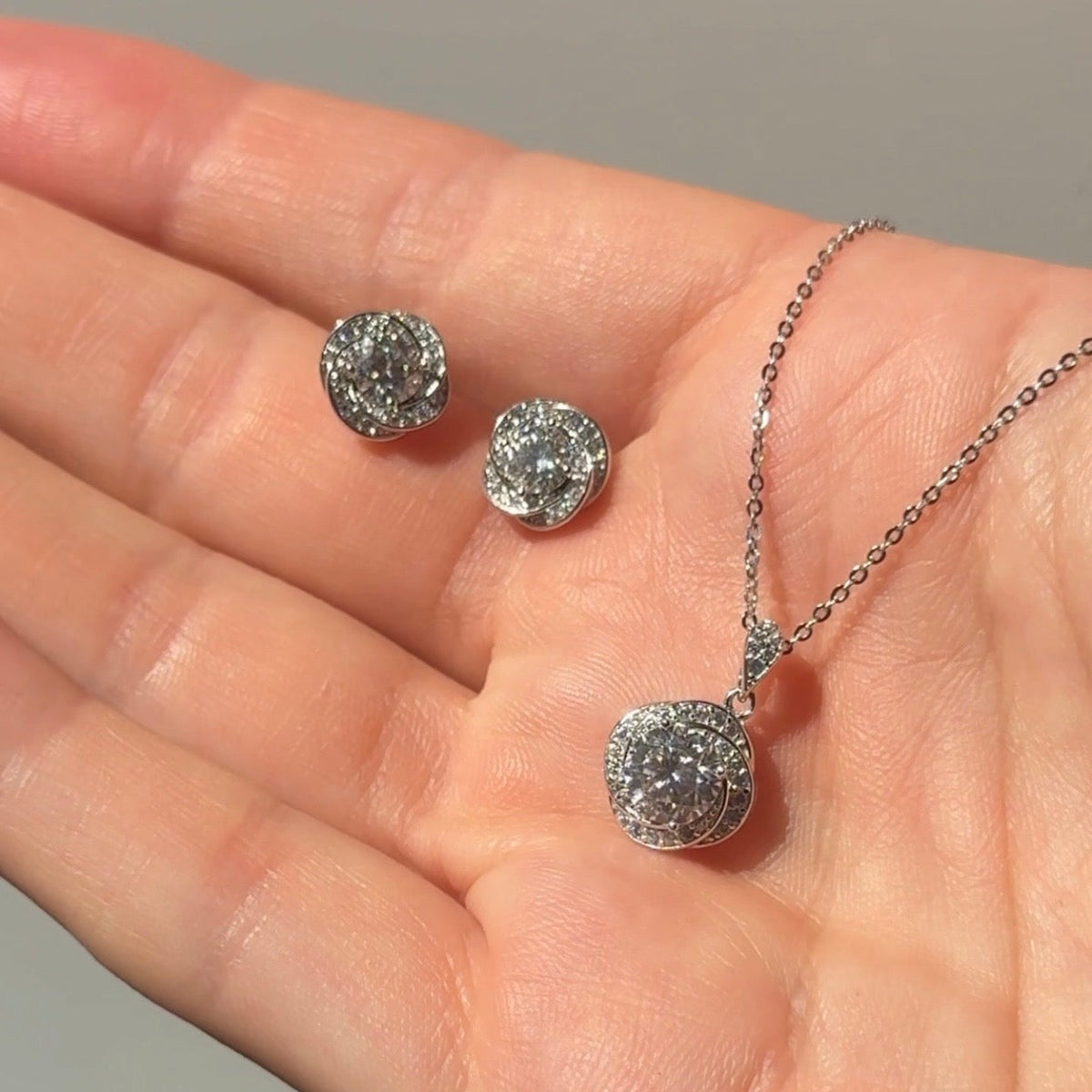 Moissanite love-knot pendant necklace with matching halo stud earrings