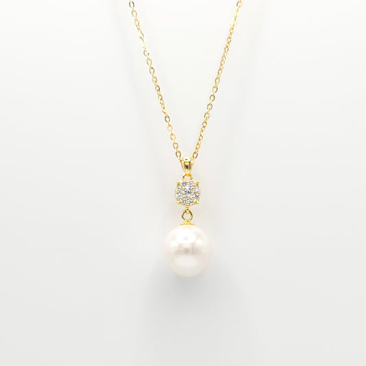 Gold pearl and diamante drop necklace with round pearl pendant and studded clasp