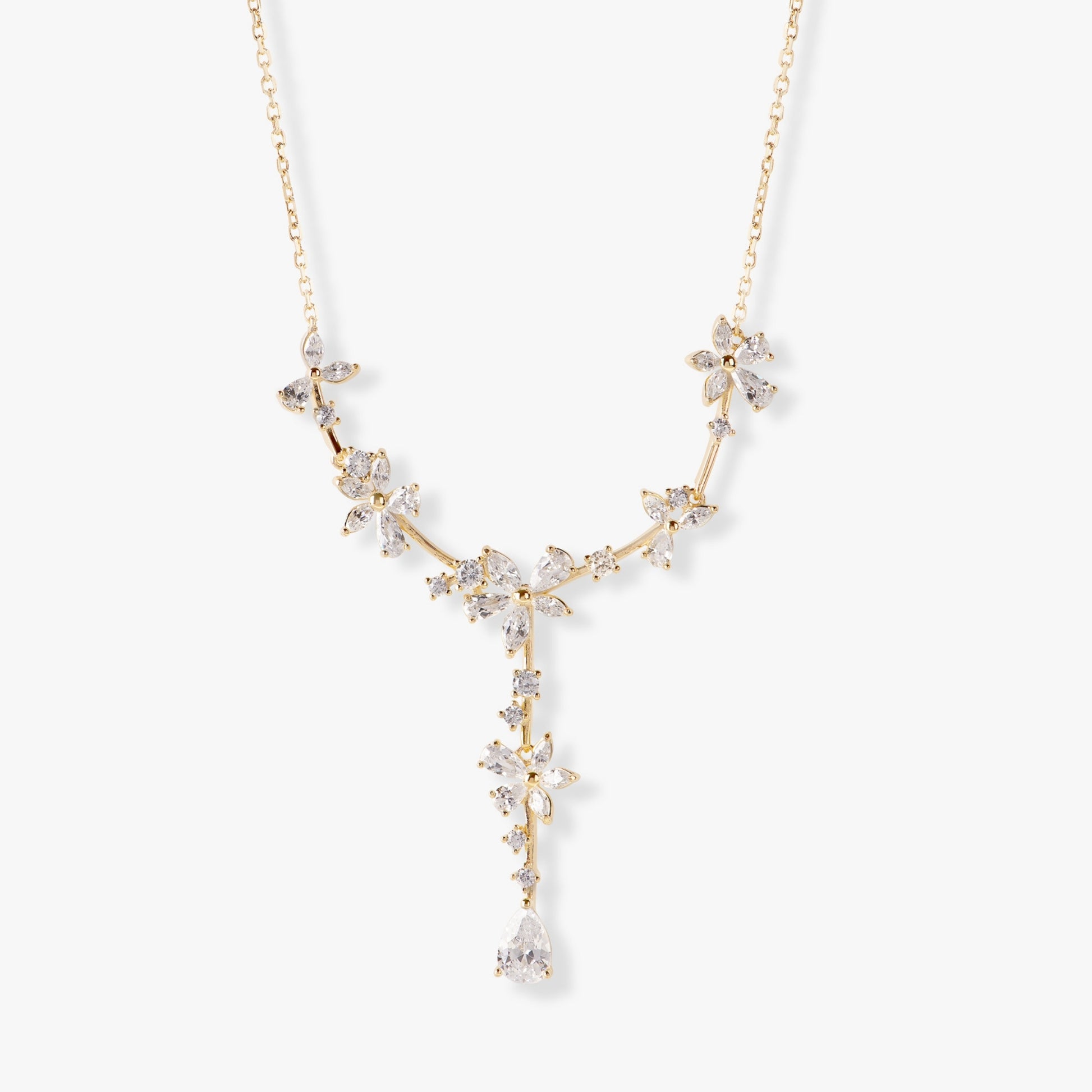 Gold bridal crystal floral necklace with starburst links and teardrop drop pendant