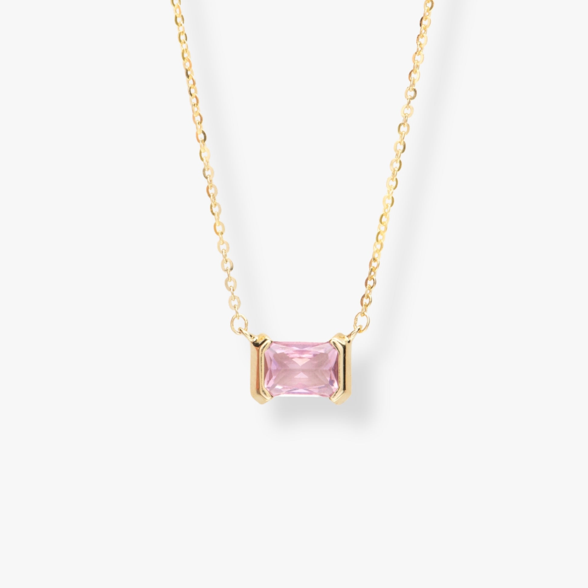 Gold-tone necklace with pink square gemstone pendant and link chain