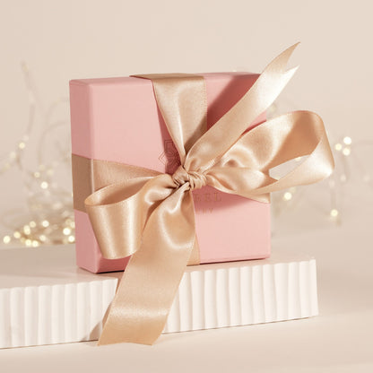 Cream satin gift bow with two loops and long ribbon tails