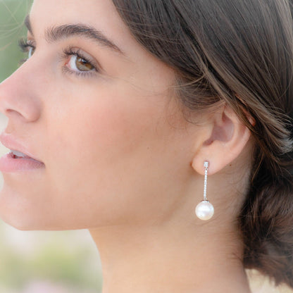 Long pearl drop earrings with rhinestone pavé chain and round pearl dangle