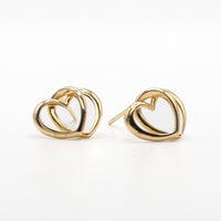 Gold-tone heart stud earrings with curved interlocking loops