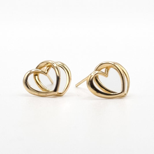 Gold-tone heart stud earrings with curved interlocking loops