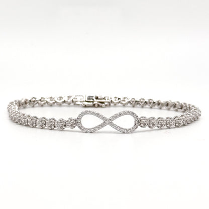 Silver infinity bracelet with crystal tennis links and an infinity symbol charm.