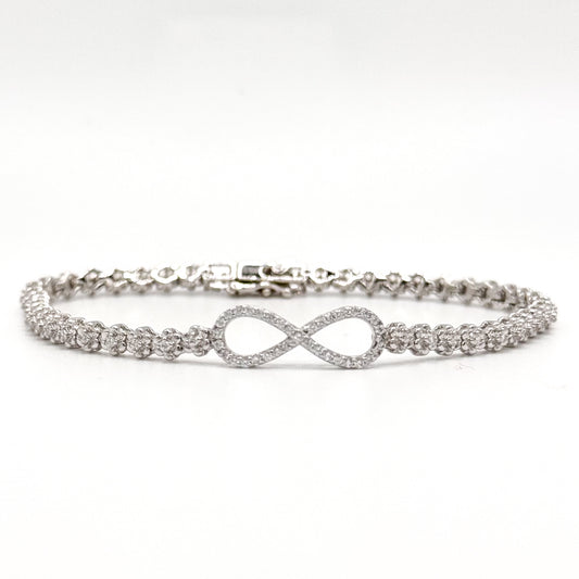 Silver infinity bracelet with crystal tennis links and an infinity symbol charm.