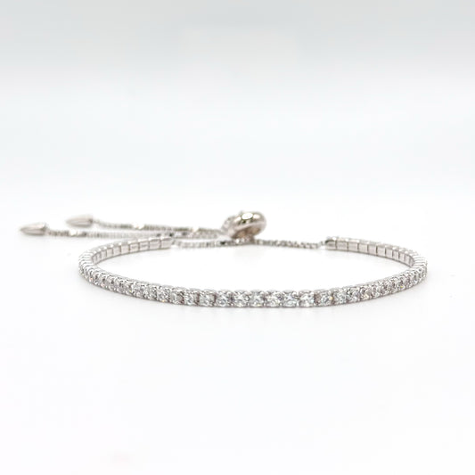 Adjustable tennis bracelet, silver-tone with round rhinestone row and hook clasp