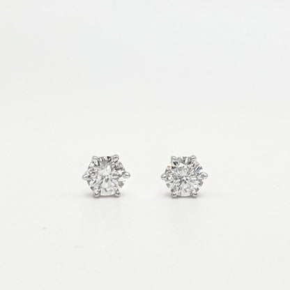 Round lab-grown diamond stud earrings with prong settings, silver-toned posts