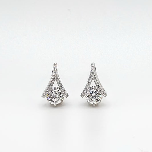 Teardrop diamond stud earrings with prong-set stones, halo and tapered top.