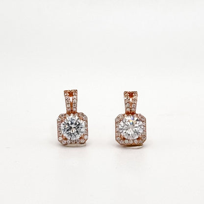 Rose gold square stud earrings with round center stone and jeweled square border.